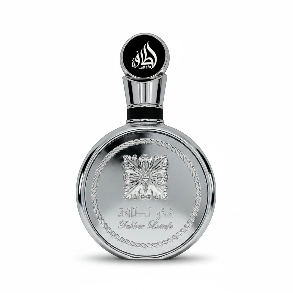 Rimaal Lattafa Fakhar Platin Eau de Parfum in einer eleganten, runden silbernen 100ml Flasche mit floralem Relief.