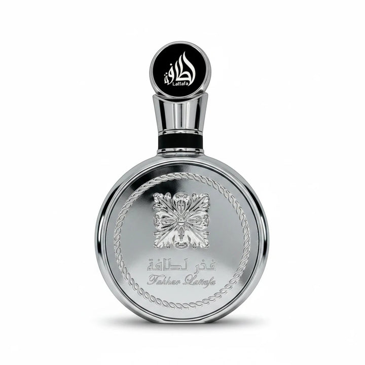 Rimaal Lattafa Fakhar Platin Eau de Parfum in einer eleganten, runden silbernen 100ml Flasche mit floralem Relief.