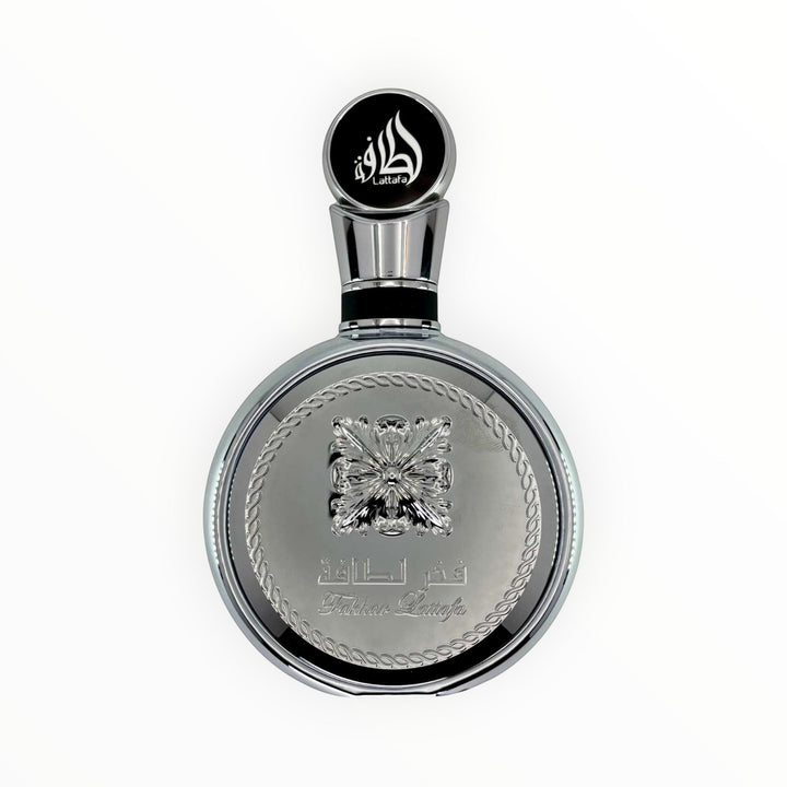 Rimaal Lattafa Fakhar Platin Eau de Parfum in einem eleganten, runden silbernen Flakon mit orientalischen Details.